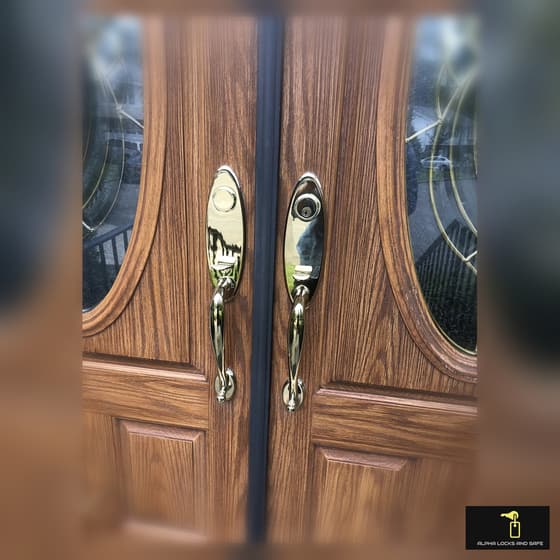 Brass front-door deadbolt and handleset photographed during an Alpha Locks emergency locksmith call in Westchester County NY