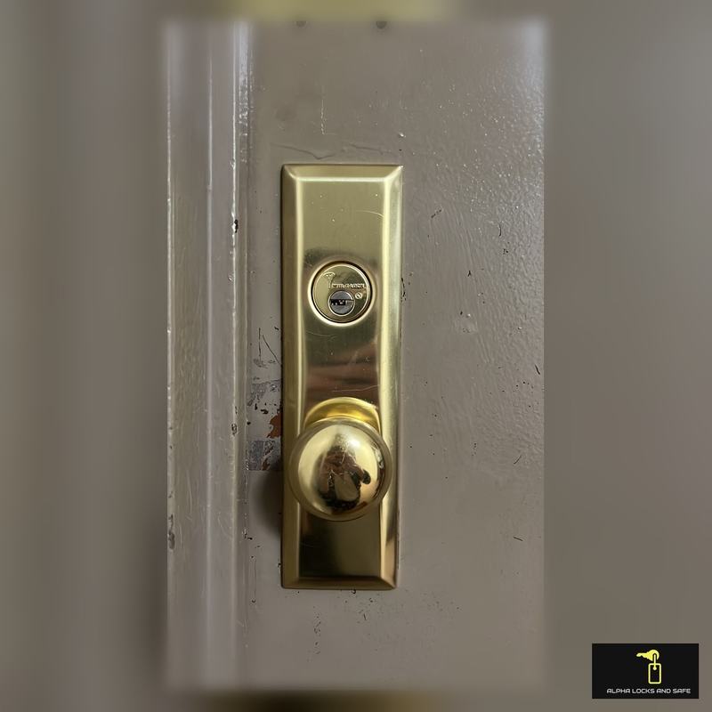 New brass front door lock installation for a Scarsdale home entry